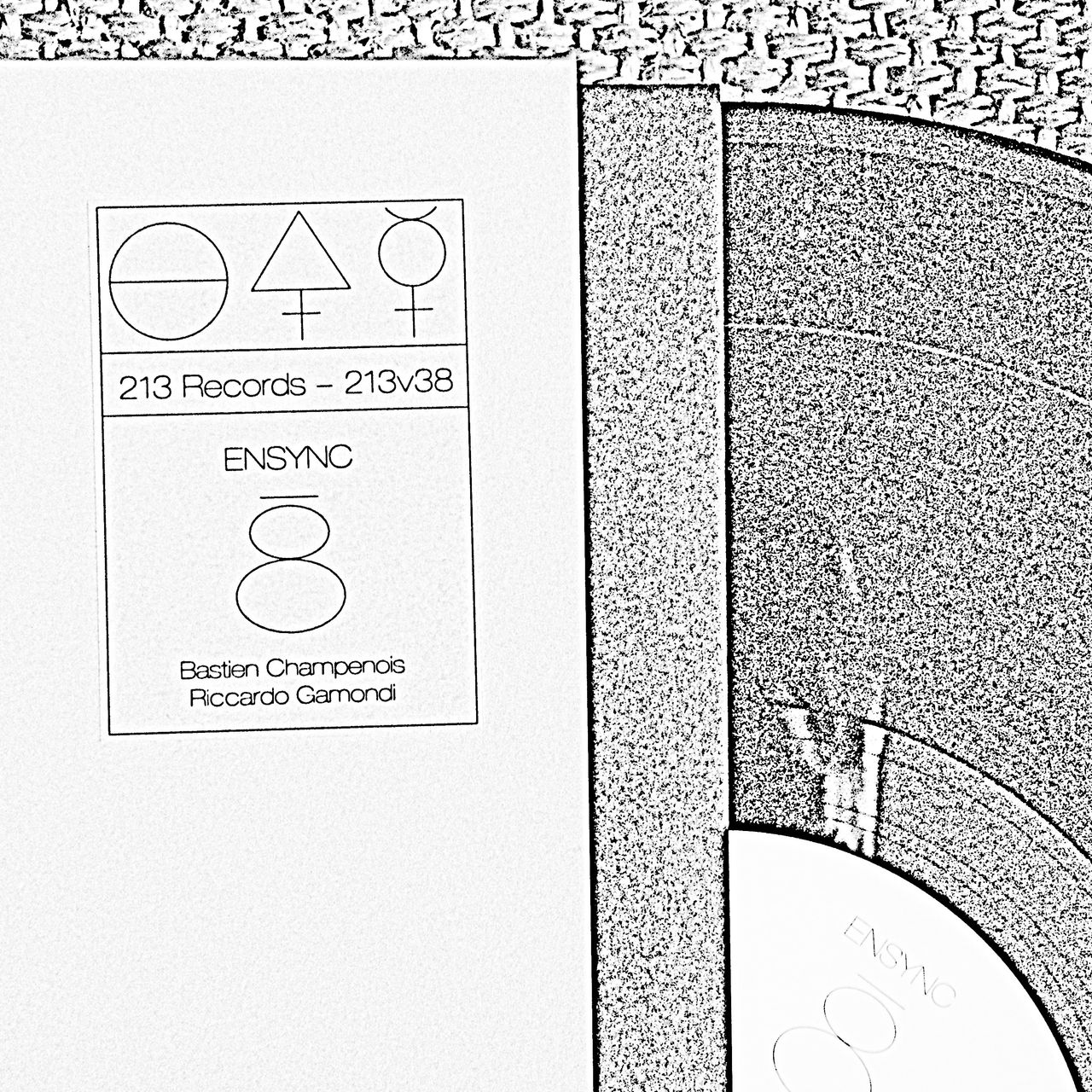 black and white picture of the record, we see the cover, the sticker with the band's name and the vinyl itself